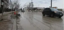  ?? JACK LAKEY ?? Tippett Rd. is coated with a thick layer of soupy mud, tracked onto the street by trucks departing condo constructi­on sites on both sides, south of Wilson Ave.