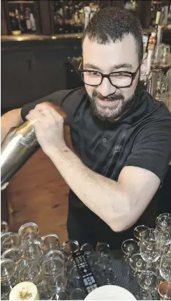  ??  ?? ED KAISER Moe Mardani, left, a bartender at the Hotel Macdonald, is competing in a craft cocktail competitio­n tonight called Made with Love, a first for Edmonton. His competitio­n includes Leland Morrison, centre, who mixes an Armchair Cynic drink at...