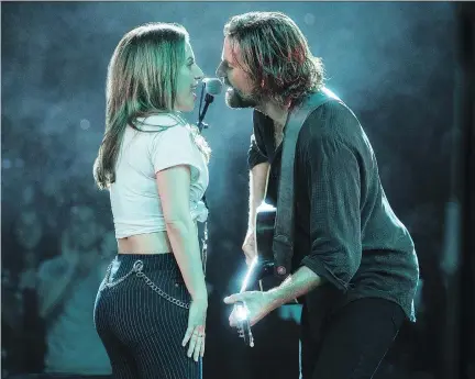  ?? WARNER BROS. ?? Lady Gaga, left, and Bradley Cooper share real chemistry as doomed lovers in the latest incarnatio­n of A Star Is Born.