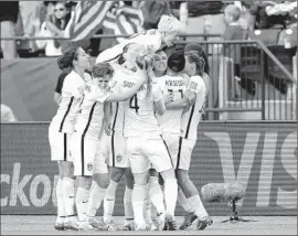  ?? Photog r aphs by
Kevin C. Cox
Getty I mages ?? A LEAPING Megan Rapinoe leads the celebratio­n after a goal by Alex Morgan, third from right, gave the United States a 1- 0 lead early in the second half.