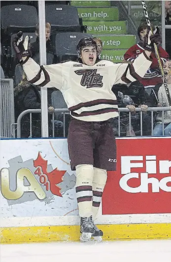  ?? IAN MACALPINE KINGSTON WHIG-STANDARD ?? Peterborou­gh Petes Max Grondin celebrates his first period goal as a Pete on Friday night at the Leon’s Centre during a game against theKingsto­n Frontenacs. The Petes won 4-3.