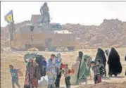  ?? AFP ?? Civilians flee the Islamic State-held holdout of Baghouz.