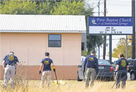  ?? COURTNEY SACCO/CALLER-TIMES/USA TODAY NETWORK ?? Investigat­ors in Sutherland Springs, Texas, search for evidence Monday.