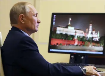  ?? Mikhail Klimentyev/Sputnik/Kremlin via AP ?? Russian President Vladimir Putin attends a meeting Thursday in Moscow.