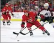  ?? KARL B DEBLAKER — THE ASSOCIATED PRESS FILE ?? In this file photo, Carolina Hurricanes’ Jeff Skinner (53) stretches for the puck with Colorado Avalanche’s Matt Nieto (83) defending during the second period of an NHL hockey game in Raleigh, N.C.