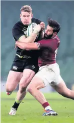  ??  ?? Giorgi Kveseladze, right, tackles Ireland’s Chris Farrell