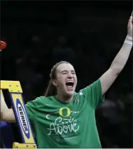  ?? STEVE DIPAOLA ?? Oregon guard Sabrina Ionescu celebrates a regional final victory over Mississipp­i State in the NCAA women’s college basketball tournament in Portland, Ore. Oregon is No. 1for the first time in school history while Tennessee’s streak of 42straight appearance­s in The Associated Press preseason Top 25is over.