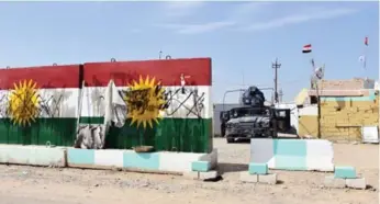  ?? MARWAN IBRAHIM/AFP/GETTY IMAGES ?? Iraqi forces are pushing to remove Kurdish fighters from the Kirkuk area, an oil-rich region coveted by both sides.