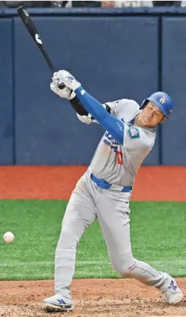  ?? JUng YEOn-JE/AgEncE frAncE-prEssE ?? sHOHEI Ohtani kicks off his Los Angeles Dodgers career with a 5-2 win over the san Diego padres in south Korea.