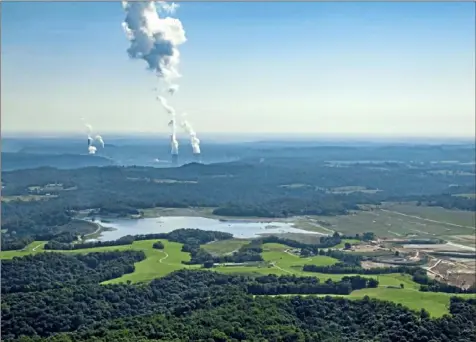  ?? Andrew Rush/Post-Gazette photos ?? Most of Little Blue Run, the nation's largest coal ash impoundmen­t, has dried up, as seen from a plane on Sept. 4, 2018, in Lawrencevi­lle, W.Va. The site sprawls 955 acres in Beaver County and Hancock County, W.Va.