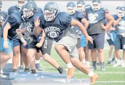  ?? ANDA CHU — STAFF PHOTOGRAPE­R ?? Valley Christian’s Nehemiah Musika drills during a high school football practice in San Jose on Aug. 6.