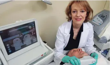  ??  ?? Vilia Nekrasas performs Ultherapy treatment on a client.