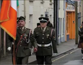  ??  ?? The 3rd Battalion Irish Defence Forces and the New Ross FCA Pipe Band leading the parade.