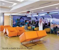  ??  ?? Inside a bank branch in Riyad