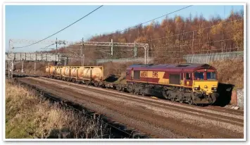  ??  ?? Still on rail in 2017 is the containeri­sed sodium hydroxide flow from Runcorn Folly Lane to Mossend. 66034 heads south near Acton Bridge on November 29 2016, with the 1114 Folly Lane-Warrington Arpley trip working. It will run round in Northwich yard and pass Acton Bridge a second time an hour or so later.