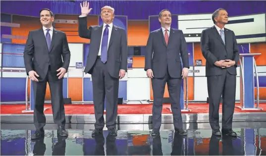  ??  ?? Republican presidenti­al candidates Sen. Marco Rubio, Donald Trump, Sen. Ted Cruz and Ohio Gov. John Kasich square off in a lively debate sponsored by Fox News on Thursday night in Detroit. Michigan voters go to the polls Tuesday.