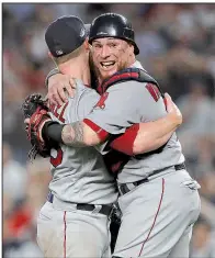  ?? AP/JULIE JACOBSON ?? Boston Red Sox catcher Christian Vazquez (right) hugs relief pitcher Craig Kimbrel after the Boston Red Sox defeated the New York Yankees 4-3 to win the American League division series. Boston will meet Houston on Saturday to begin the American League Championsh­ip Series.