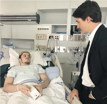  ??  ?? Ryan Straschnit­zki, one of the survivors of the tragic Humboldt Broncos bus crash, is visited by Prime Minister Justin Trudeau two days after the April 6 accident.