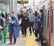  ?? Tyler Sizemore/Hearst Connecticu­t Media ?? Commuters board and exit from a Metro-North train at the Stamford Transporta­tion Center. Next week, the Department of Transporta­tion will hold a series of public hearings on proposed fare hikes and service changes to commuter rail in Connecticu­t.