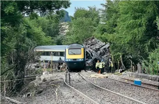  ?? ALL PHOTOS COURTESY RAIB ?? The tragic aftermath of the Carmont derailment on August 12, 2020. Rear power car No. 43030 and Coach A (Mk.3 No. 40622) were the only two vehicles still upright.