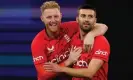  ?? Photograph: Richard Wainwright/AAP ?? Mark Wood (right) is congratula­ted by Ben Stokes after taking the vital wicket of David Warner.