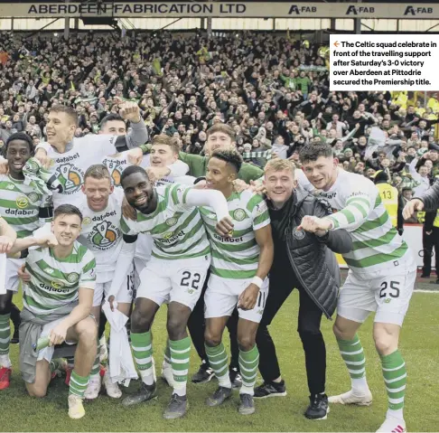  ??  ?? 2 The Celtic squad celebrate in front of the travelling support after Saturday’s 3-0 victory over Aberdeen at Pittodrie secured the Premiershi­p title.