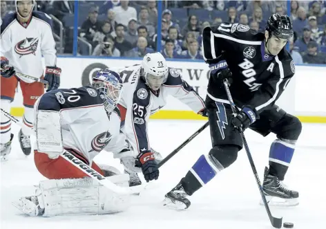  ?? CHRIS O’MEARA/AP FILES ?? Tampa Bay centre Brian Boyle takes a pass in front of the Columbus last month. The Toronto Maple Leafs have plugged a year-long hole at the fourth-line centre spot, swinging a trade with the Lightning for Boyle on Monday.