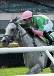  ?? NYRA PHOTO BY ROBERT MAUHAR ?? Disco Partner, with Irad Ortiz Jr. up, won the Elusive Quality Stakes April 29 at Belmont Park. The 5-year-old New York-bred will step up in class for Saturday’s Grade 1 Fourstarda­ve Handicap.