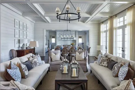 ?? BRIAN BIEDER — MAGGIE GRIFFIN VIA AP ?? Designer Maggie Griffin says homeowners often hang ceiling fixtures too high, especially over dining tables. It’s important that they be low enough to illuminate the room and that overhead light is balanced by light from table lamps.