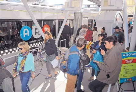  ?? JIM THOMPSON/JOURNAL ?? Passengers unload from one of the new Albuquerqu­e Rapid Transit buses at the BioPark in November. The ART project isn’t yet running.