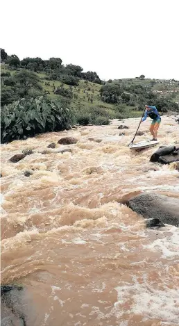  ??  ?? Stand-boarding on the Msunduzi River is strenuous and exciting, but the health risks are always close by.