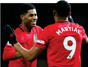  ??  ?? HE’S SPOT-ON: Rashford is hailed by Martial after converting his penalty to secure United a two-goal advantage