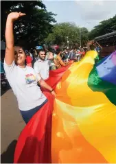  ??  ?? People celebrate the Supreme Court ruling decriminal­ising Section 377 in New Delhi on Thursday.