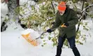  ?? A man shovels snow during a snowstorm in Buffalo, New York, on Friday. Photograph: Lindsay Dedario/Reuters ??