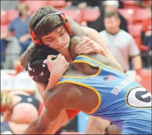  ?? RICK PECK/ SPECIAL TO MCDONALD COUNTY PRESS ?? McDonald County 126-pound Aydan Ball is on his way to pinning MarZell Sullivan of Grandview to give the Mustangs their lone win of the day at the CJ Classic Wrestling Tournament held on Dec. 12 at Carl Junction High School.