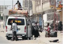  ?? S A L E H A L - O B E I D I / A F P/ G E T T Y I MAG E S ?? Yemenis pack a vehicle as they flee from the southern Yemeni city of Aden on Monday as Arab coalition warplanes continue to carry out airstrikes against Shiite Houthi rebels.