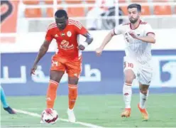  ?? ?? ±
Players of Sharjah and Ajman vie for the ball during their ADNOC Pro League match on Thursday.