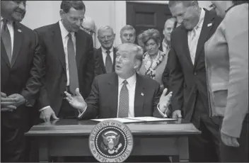  ?? The Associated Press ?? Streams: President Donald Trump speaks as he signs the Waters of the United States (WOTUS) executive order, Tuesday, in the Roosevelt Room in the White House in Washington.