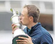  ?? [AP PHOTO] ?? Jordan Spieth kisses the trophy after winning the British Open on Sunday at Royal Birkdale, Southport, England.