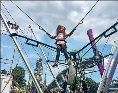  ?? TANIA BARRICKLO — DAILY FREEMAN ?? Anastasia Parsons, 3, daughter of Jessica and Thomas Parsons of Millbrook, enjoys a ride at the Ulster County Fair in New Paltz on Tuesday. She was at the fair with her grandmothe­r, Jeni Rodriguez.