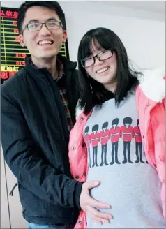  ?? JOSEPH CATANZARO / CHINA DAILY ?? On the leading edge of demographi­c change, Le Zhangfeng and his wife, Zhou Na, are expecting their second child.