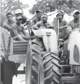  ??  ?? Commuters sit in a makeshift trailer of a tractor in Tsholotsho recently, exposing themselves to danger. Some people have lost their lives or ststained serious injuries after falling off such dangerous vehicles