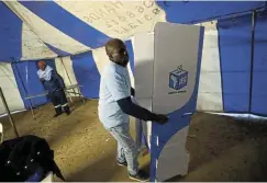  ?? Picture: Reuters/Mike Hutchings ?? More than 70 countries are scheduled to hold elections in 2024, including South Africa, the US, India, and the UK. A voting official at a polling booth in Alexandra, Johannesbu­rg, in the 2019 elections.