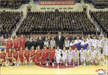  ?? KOREAN CENTRAL NEWS AGENCY/KOREA NEWS SERVICE VIA AP ?? In this Tuesday, photo provided today, by the North Korean government, Chinese hoop legend Yao Ming (center rear) poses for a group photo with Chinese and North Korean basketball players after their friendly match in Pyongyang, North Korea.