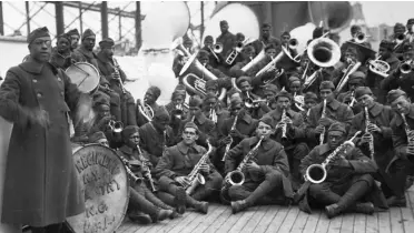  ??  ?? This picture, taken in February 1919, shows US 369th Infantry Regiment Jazz orchestra aboard the SS Stockholm heading to the United States