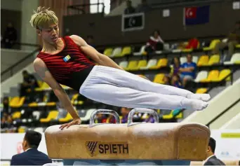  ??  ?? Going all out: Jeremiah Loo in action in the boys’ individual all-around event at the Indera Mulia Stadium yesterday.