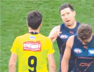  ?? Picture: Fox Sports ?? Toby Greene walking towards umpire Matt Stevic before making contact.