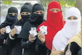 ?? HT PHOTO ?? Muslim women waiting to cast their vote on Sunday.