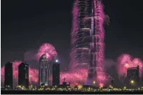  ?? Sarah Dea / The National ?? Fireworks explode over Downtown Dubai to ring in new year. This new year promises more spectacles.