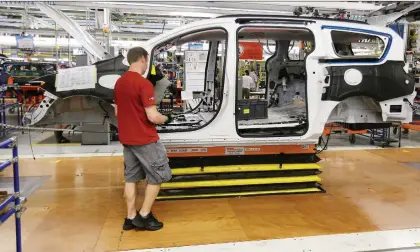  ?? CARLOS OSORIO/THE ASSOCIATED PRESS FILES ?? Fiat Chrysler has announced it will eliminate a third line at its Windsor Assembly plant, pictured, which makes the Chrysler Pacifica and Dodge Grand Caravan. Analysts blame trade headwinds and the cyclical downturn with declining auto sales.